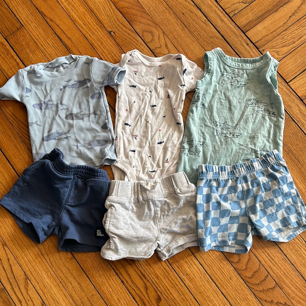 Mix of 12 month Carter’s, grammars, and Gerber boy clothes.